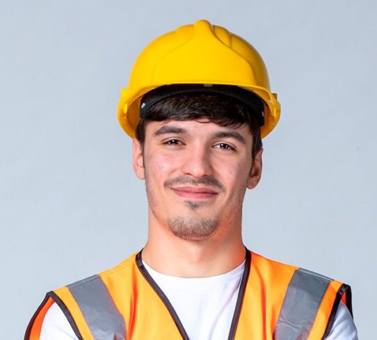 front view male builder uniform yellow helmet white wall